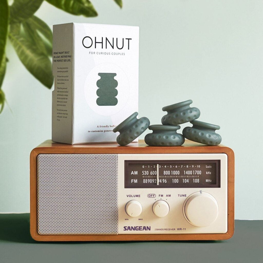 box with the word ohnut and 4 ohnut rings sitting on top of an old radio