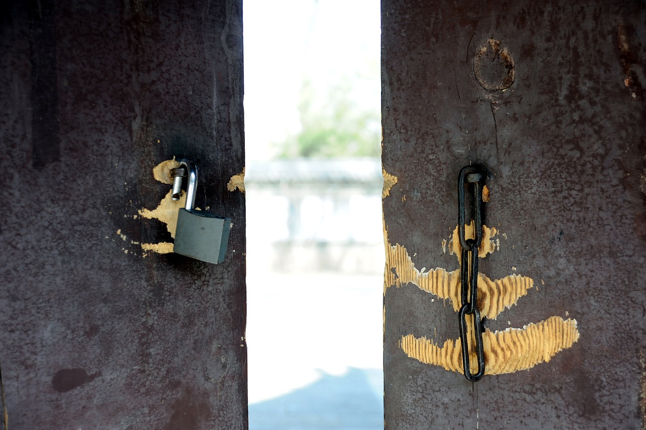 looking through an open door with a broken lock.