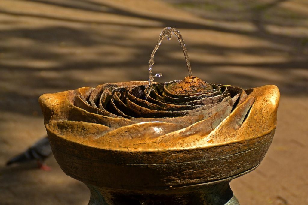 vulva looking fountain squirting water